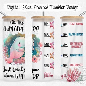 May include: A white 25-ounce frosted tumbler with a manatee design and the text "Oh The Humanatee" and "Just Drink Your Darn Water". The tumbler also has a time-based water tracker with a starfish design and the text "Start Sippin", "Sea You Can Do It", "Sea This Water, Now Drink It", "Almost There", and "You Did It!"