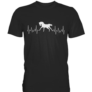 Peut inclure: T-shirt noir avec une silhouette blanche d'un cheval courant avec un graphique de battement de cœur.
