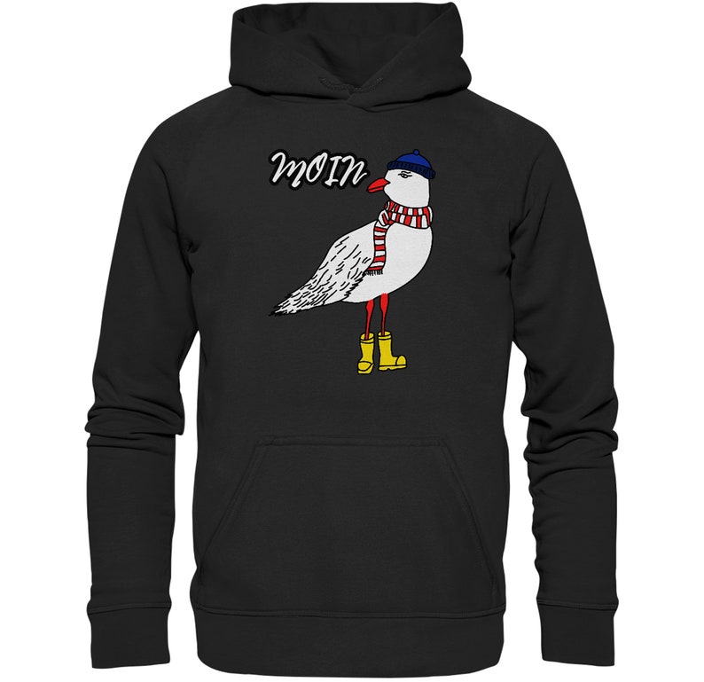 May include: Black hoodie with a white seagull wearing a blue hat, red and white scarf, and yellow rain boots. The text "Moin" is printed above the seagull.