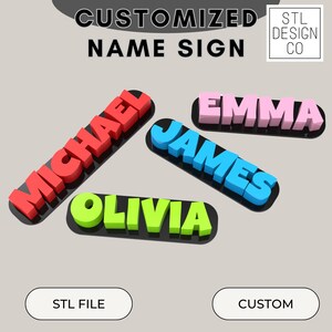 May include: Five 3D printed name signs, each with a different name and color. The names are Michael, Emma, James, Olivia, and the text "STL DESIGN CO" is in the top right corner. The names are on a gray background with two buttons that say "STL FILE" and "CUSTOM".