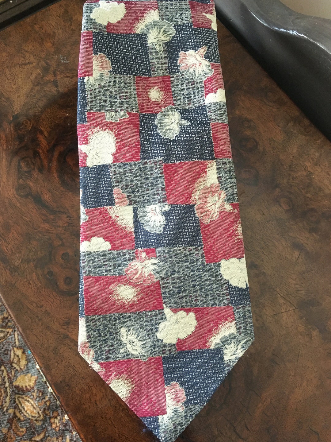 blue suit white shirt burgundy tie