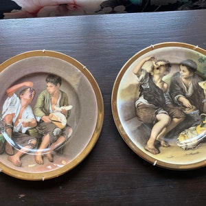 2 collectible plates The Beggar Boys, Fenton China Company. English Bone China. Gilt Edge by Bartolome Esteban Murillo with wall hangings