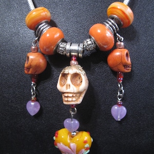 Spooky Statement Necklace = Murano Beads/Czech Glass and Skelly Bead in Orange Tones with purple accent hearts