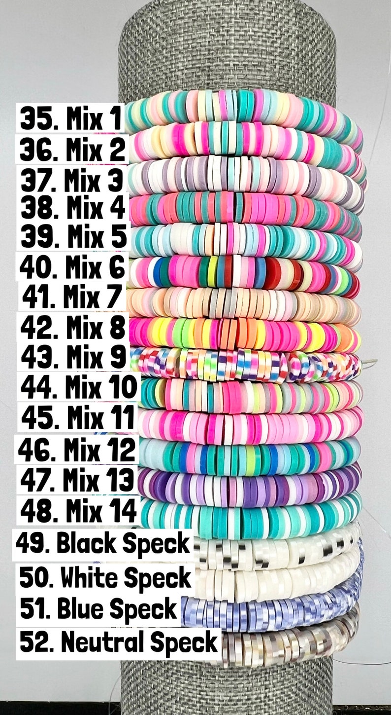 May include: A stack of colourful round beads, labelled with numbers 35 to 52. The beads are arranged in rows, with each row labelled with a different mix number or type of bead. The beads are made of plastic and have a variety of colours, including pink, blue, green, yellow, and white.