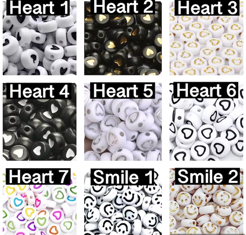 May include: Assortment of white, black and gold heart-shaped beads with black, white and gold smiley face beads.