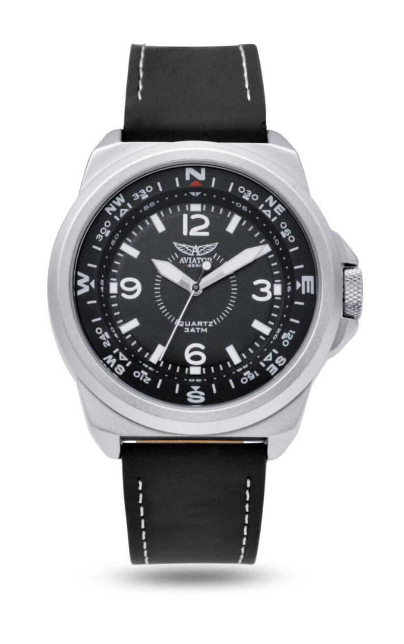 May include: Aviator watch with a silver-coloured case, black dial, and a black leather strap. The watch face displays Arabic numerals, a compass rose, and the text "QUARTZ 3ATM". The strap is 2.2cm wide.