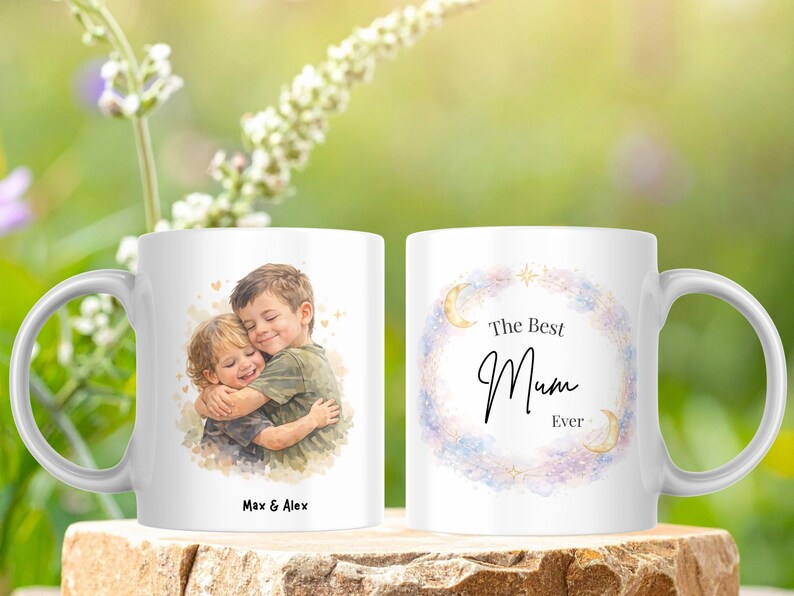 May include: White ceramic mug featuring a watercolor illustration of two children hugging, with the text "Max & Alex" below. The other side has the text "The Best Mum Ever" inside a floral wreath.
