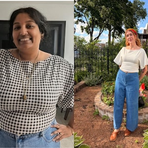 May include: A black and white gingham print top with short sleeves and a wide neckline paired with blue denim jeans. The outfit is styled with a layered gold necklace and a simple white short-sleeved top with blue wide-leg denim trousers.