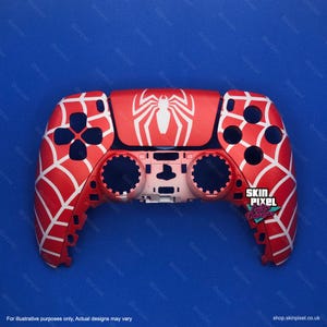 May include: A red and white PlayStation 5 controller with a spider web design and a white spider logo. The controller has a black button layout and a white PlayStation logo. The text "SKIN PIXEL CUSTOM" is on the bottom right corner of the controller.
