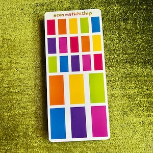 May include: A sheet of colourful stickers with the text "neon mothership" at the top. The stickers are arranged in a grid of 18 squares, with each square containing a different colour. The colours include red, orange, yellow, green, blue, purple, and pink.