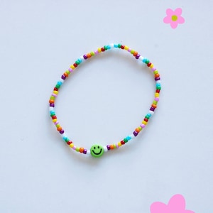Bracelet de perles colorées avec smiley différentes variantes grüner Smiley
