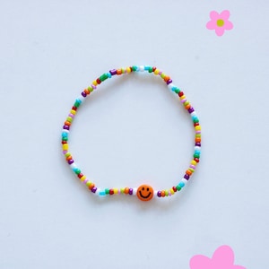 Bracelet de perles colorées avec smiley différentes variantes orangener Smiley