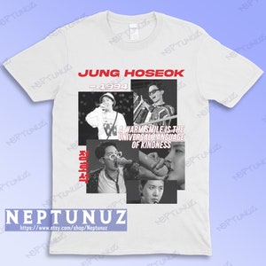 May include: White t-shirt featuring a collage of black and white images of Jung Hoseok. The text "JUNG HOSEOK - 1994" is in red. Below the images is the text "A warm smile is the universal language of kindness."