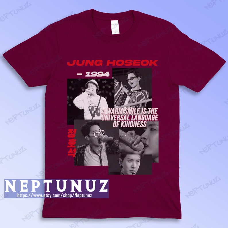 May include: Burgundy t-shirt featuring a collage of images and text. The text includes "JUNG HOSEOK - 1994" and "A WARM SMILE IS THE UNIVERSAL LANGUAGE OF KINDNESS." The shirt also has the shop's name and website address.