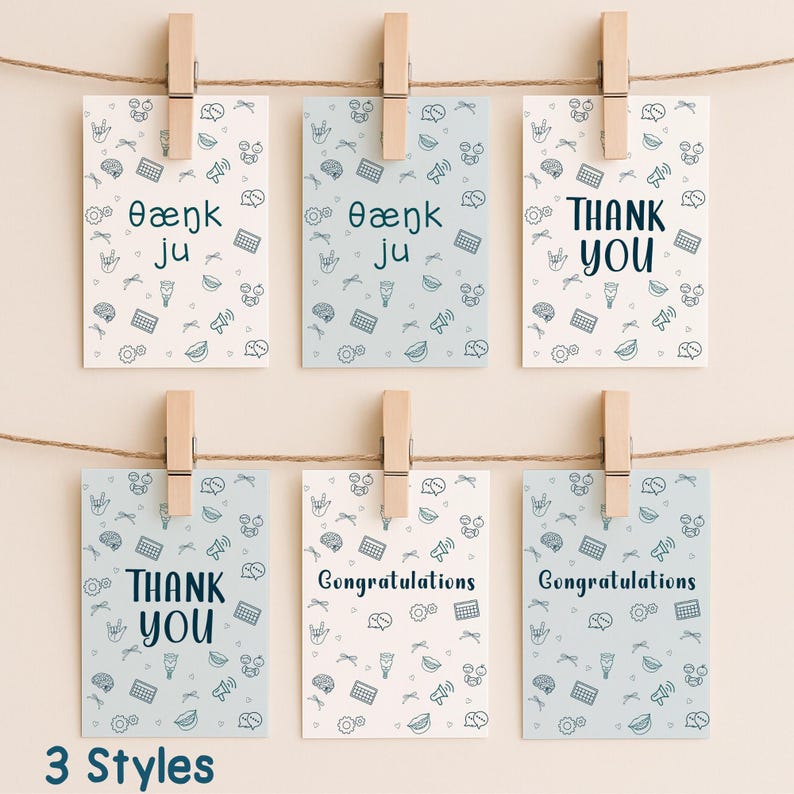 A collection of six printable SLP greeting cards clipped on a string, featuring designs that say “Thank You,” “Congratulations,” and “θæŋk ju” in two background styles. Cards are decorated with speech therapy-related illustrations and ready for digital download.