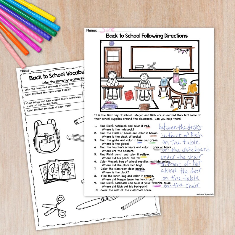 May include: Two worksheets with school-themed vocabulary and following directions exercises. The worksheets are on a wooden surface with colorful pencils. The "Back to School Following Directions" worksheet has a classroom illustration with instructions.