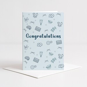 A digital greeting card with “Congratulations” displayed in a bold font, surrounded by SLP symbols like a brain, speech bubble, vocal tract, and gear icons. The card is folded and placed on a white envelope, perfect for printing and giving to SLP grads.