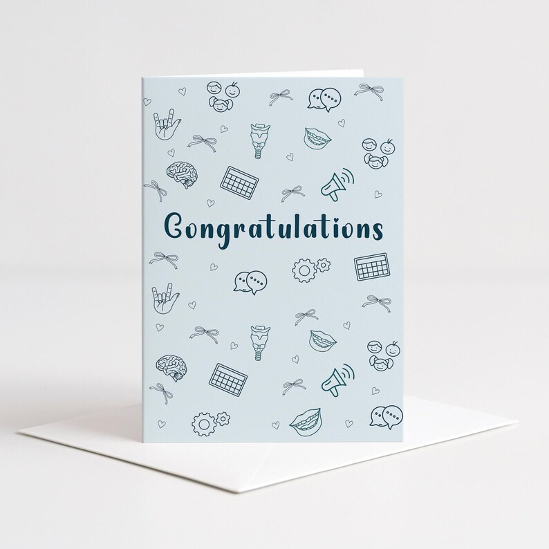 A digital greeting card with “Congratulations” displayed in a bold font, surrounded by SLP symbols like a brain, speech bubble, vocal tract, and gear icons. The card is folded and placed on a white envelope, perfect for printing and giving to SLP grads.