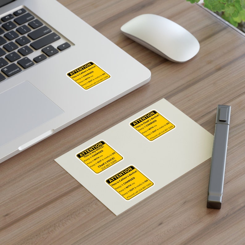 Picture shows a set of personalized AAC stickers.  The SPED stickers are yellow with black lettering.  The SLP stickers include a person's name and Attention, this is my voice.  Keep it charged.  Keep it with me.  Keep it out and ready to go!