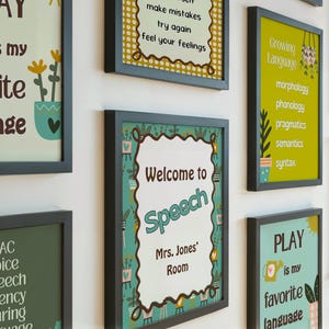 May include: A collection of framed educational posters with text and illustrations. One poster reads "Welcome to Speech, Mrs. Jones' Room." Other posters feature phrases like "Growing Language" and "Play is my favorite language."