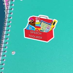 May include: A red toolbox with a white border and the words "Speech Toolbox" on the front. The toolbox is filled with various speech therapy tools, including a pirate hat, bubbles, a book, play dough, and a picture card set.