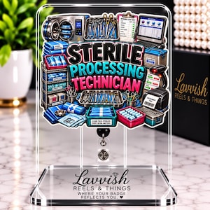 May include: A clear acrylic badge reel featuring a colorful graphic of a sterile processing technician workstation with medical instruments, a computer, and sterilization equipment. The text reads Sterile Processing Technician and Lavvish Reels & Things.