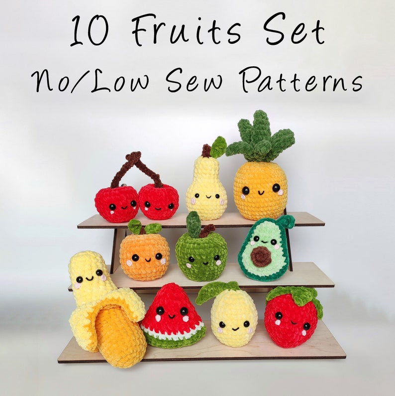 May include: A set of 10 crochet fruit patterns. The patterns are for making no-sew or low-sew plush toys. The fruits include a pineapple, pear, cherries, apple, avocado, banana, watermelon, lemon, and strawberry. The fruits are all smiling and have cute faces.