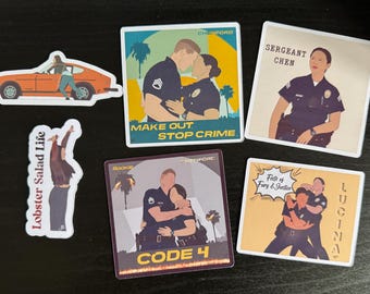May include: A collection of six stickers featuring illustrations of police officers. Designs include an orange car, a person stretching with text Lobster Salad Life, and four square stickers with characters, palm trees, and text like Make Out Stop Crime, Sergeant Chen, Code 4, and Fists of Fury & Justice.