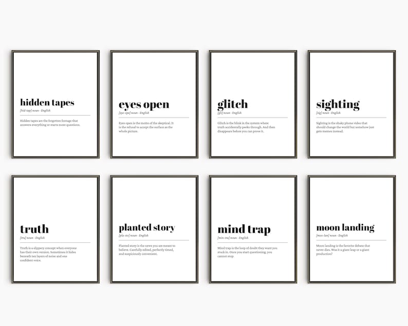 May include: Eight framed art prints with black frames and white backgrounds. Each print features a word in bold black text, such as "hidden tapes" or "glitch", along with a definition. The prints are arranged in two rows of four.