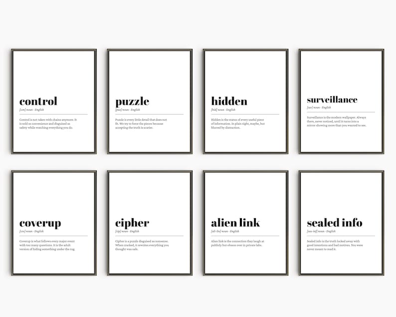 May include: Eight framed art prints with black frames and white backgrounds. Each print features a word in bold black text, such as "control" or "puzzle", along with a definition. The prints are arranged in two rows of four.