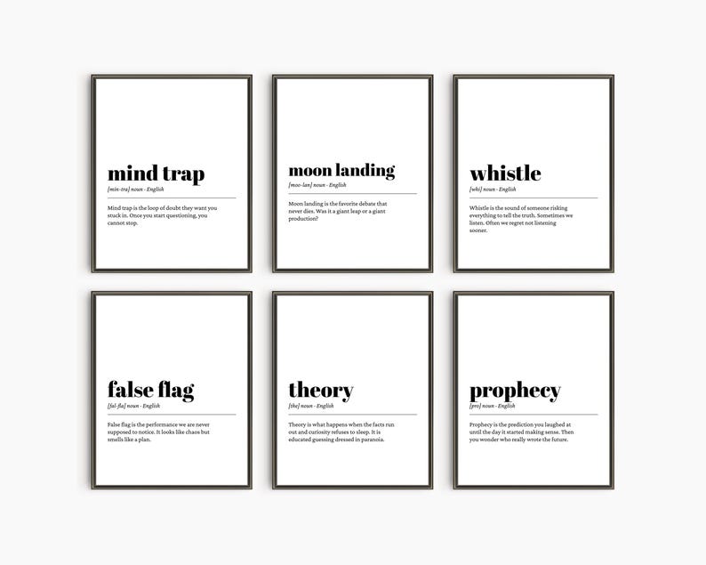 May include: Six framed prints with black frames and white backgrounds. Each print features a word in bold black text, such as "mind trap" and "moon landing", along with a definition. The prints are arranged in two rows of three.
