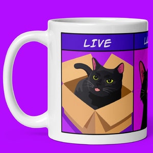 May include: White ceramic mug with a black cat in a box illustration. The mug has the words "LIVE" and "Laugh" printed on it.