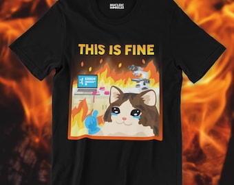 May include: Black t-shirt with the phrase "THIS IS FINE" above a cartoon cat in a burning room. The cat has a distressed expression, with a computer displaying an error message and a microscope in the background.