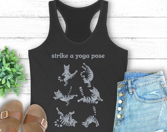 May include: Black tank top with the text "strike a yoga pose" and a graphic of six gray cats in different yoga poses.