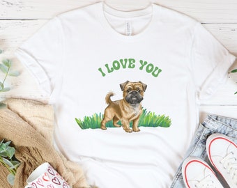 May include: White t-shirt with a brown and tan Brussels Griffon dog illustration and the text "I LOVE YOU" in green.