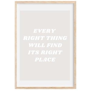 May include: A framed print with a light gray background and white text that reads "Every right thing will find its right place."