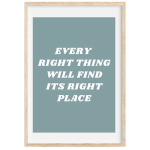 May include: A framed print with a light blue background and white text that reads "Every right thing will find its right place."