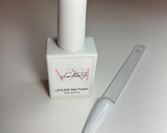 May include: A white UV/LED gel nail polish bottle with a clear cap and a matching color swatch. The bottle has a square base and a cylindrical top. The label reads "VNI" and "UV/LED Gel Polish 15 ml (0.5 fl oz)."