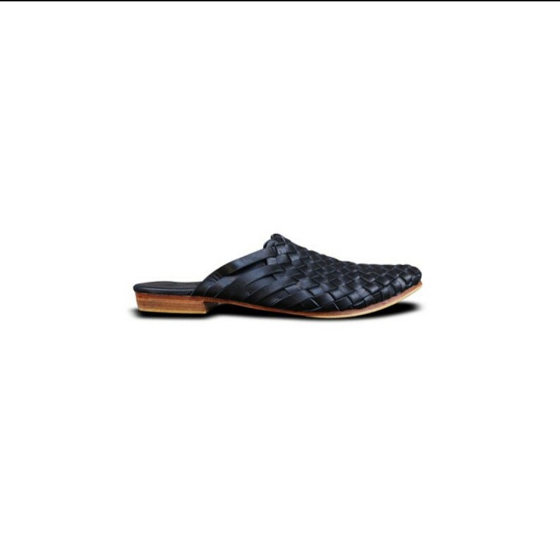 May include: Black leather woven slip-on mule with a brown leather sole.