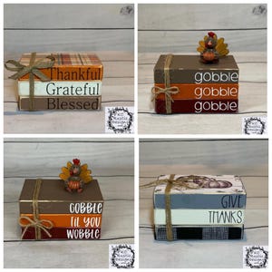 May include: Four sets of stacked wooden blocks tied with twine. The sets feature text including Thankful, Grateful, Blessed, gobble, gobble til you wobble, and Give Thanks. Some blocks have plaid or pumpkin patterns and turkey figurines.