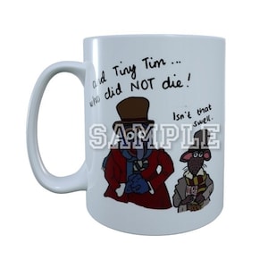May include: White ceramic mug featuring a cartoon illustration of two anthropomorphic rats in Victorian-era clothing. The mug has the text "and Tiny Tim... who did NOT die! Isn't that swell."