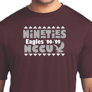 May include: Burgundy t-shirt with a white graphic that says "Nineties Eagles '90-'99 NCCU" with a stylized eagle design.