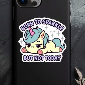 May include: A black phone case with a white unicorn graphic and the text "Born to Sparkle But Not Today".