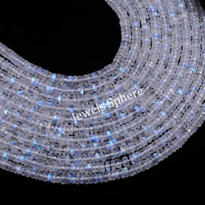 May include: A strand of white moonstone beads with a rainbow iridescent sheen. The beads are faceted and have a square shape. The beads are strung on a clear thread and are approximately 4mm in size.