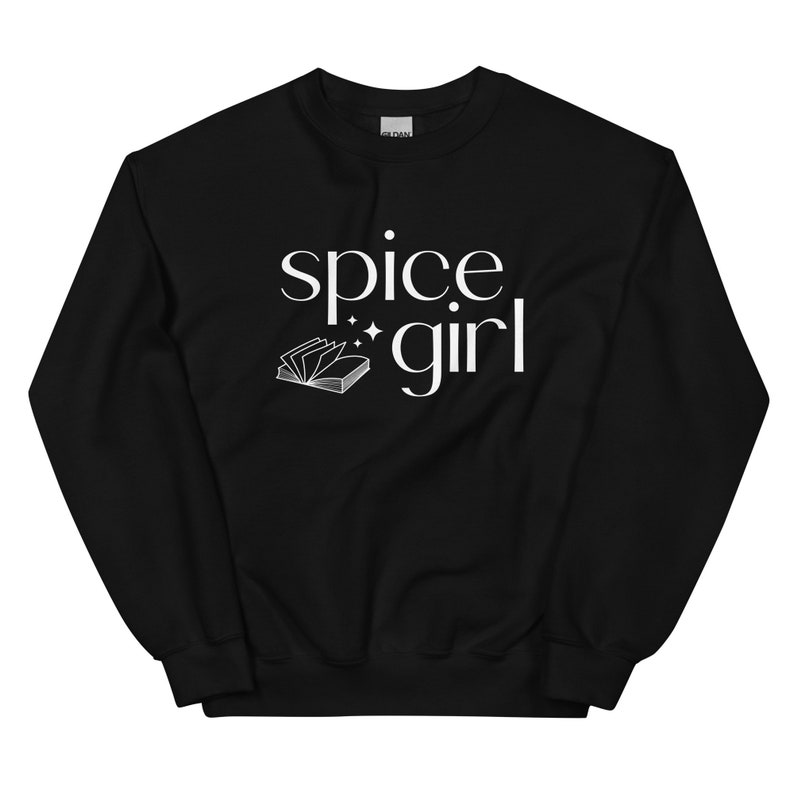 May include: Black sweatshirt with the words "spice girl" in white script. A white open book graphic is below the words. The sweatshirt is a crew neck style.