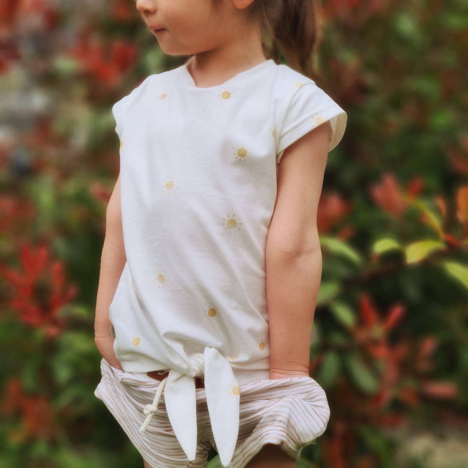 Shirt With Cross-cut Sleeves and Knots 