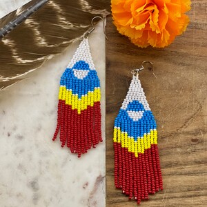 White, blue, yellow and red beaded fringe earrings