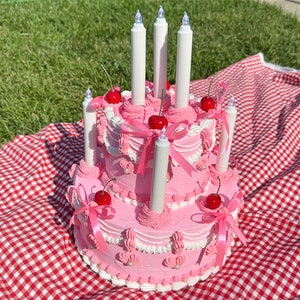 Vintage-Style Pink and White Two Tier Fake Cake with Pink Bows, Cherries, and LED Candles! Super Cute and Unique Accent Home Decor!