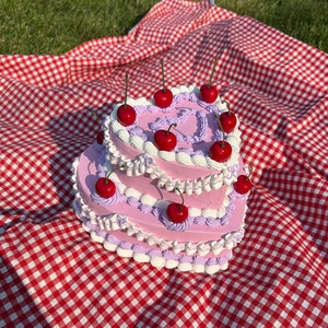 Vintage-Style Pink, Purple, and White Two-Tier Heart Shaped Fake Cake with Cherries! Includes FREE Accessory!