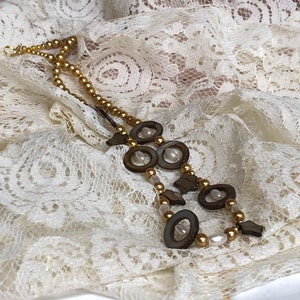 Circle and stars unique 22 in necklace brown with gold bead accents